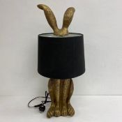 A contemporary figural rabbit lamp with shade. H.76cm.