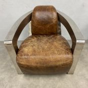 A vintage Art Deco style Halo Mars club armchair with distressed brown leather upholstered back