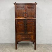 A late 19th/early 20th century Chinese hardwood and bamboo kitchen cabinet with four panel doors
