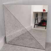 A large contemporary mirror in glazed frame with faux distressed section. 100 x 100cm