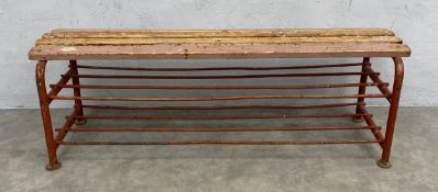 An early to mid 20th century industrial luggage rack or bench with slatted top raised on a painted