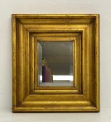 A 20th century gilt framed wall mirror with bevelled plate. H.52 W.47cm