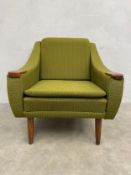 A mid-century Danish style easy lounge armchair with square back and shaped, teak clad arms over the