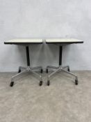 A pair of mid to late 20th century Eames Rolling Contract side tables each with square laminate