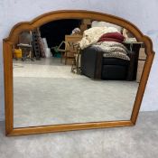 A 19th century Thomasville style overmantel mirror with central plate in a shaped cherrywood