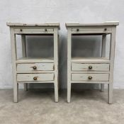 A pair of vintage painted and distressed bedside cabinets each having square galleried top with