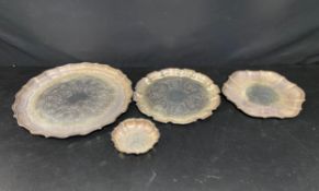 A collection of silver plated trays and salvers. Diam.41cm. (Largest).