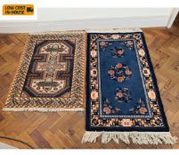 A small blue Chinese rug and a similar Persian example. 140x70cm. (Largest).