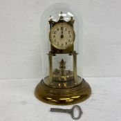 A C.1900 German brass Gustav Becker 400 day anniversary or torsion clock with three ball and spire