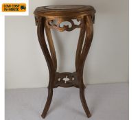 A carved giltwood jardiniere or urn stand with inset marble top. H.70cm.