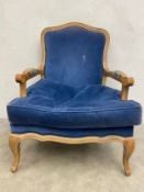 A 19th century French Louis XV style oak fauteuil armchair with shaped back and arms over the velour