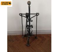 A set of 19th century fire irons on matching stand with brass finial. H.95cm.