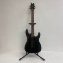 A Dean Vendetta electric guitar with stand. H.99cm.