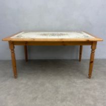 A contemporary Italian 19th century style pine dining table inset with Grottaglie tiles, painted and