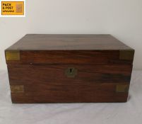A Victorian walnut brass bound writing slope with fitted interior. H.14 W.30 D.22cm.