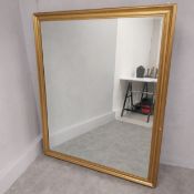 A large contemporary gilt framed wall mirror with bevelled plate. 153 x 128cm