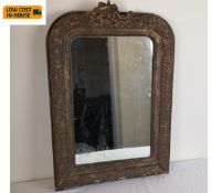 A 19th century wall mirror in arched gilt gesso frame with original plate. 57x78cm.