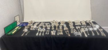 A large mixed lot of silver plated flatware cutlery to include sets of spoons, forks, knives and