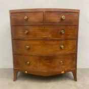 A Georgian mahogany bowfronted chest of drawers on swept bracket feet. H.109 W.100 D.55cm.