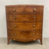 A Georgian mahogany bowfronted chest of drawers on swept bracket feet. H.109 W.100 D.55cm.