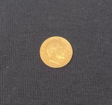 A 22ct King Edward VII gold sovereign coin, London, 1904. 8g