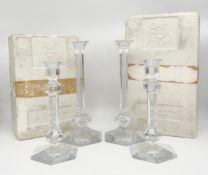 A pair of vintage cut crystal 'Elysee' candlesticks of faceted column form together with a smaller