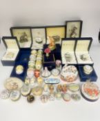 A large mixed collection (44pcs) of porcelain eggs, trinket boxes and figures by Halcyon Days,