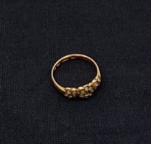 An antique 15ct hallmarked yellow gold ring with missing stones. Weight: 2.34g