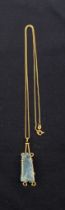 A vintage Italian hallmarked 18ct gold necklace with large rough-cut aquamarine pendant. Gross