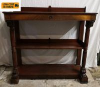A Regency mahogany console table with frieze drawer above open shelves flanked by reeded columns