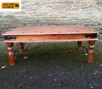 An Indian teak and metal bound low table. H.40 W.110 D.62cm.