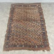 A Persian Khamseh rug with patterned polychrome field over the beige ground within multiple