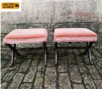 A pair of 19th century mahogany footstools on X-frame supports. H.42 W.50 D.41cm.