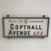A vintage enamelled milk glass 'City of London, Copthall Avenue, E.C.2.' street sign in a painted