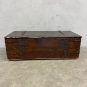A C.1900 Spanish style coffer of chest with iron clad plank top and carcass and paper lined