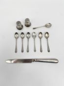 A mixed lot to include a pair of sterling silver salt and pepper shakers, a set of six early 20th