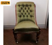 A 19th century mahogany nursing chair in deep buttoned satin upholstery. Seat height 42cm.