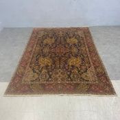 A Persian Heriz carpet with central quatrefoil medallion in a scrolling foliate field over a
