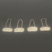 A set of four engraved white metal decanter tags for French Vermouth, Apricot and Cherry Brandy