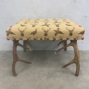 A contemporary Scottish handmade red deer antler stool by House of Bruar with Hines of Oxford animal