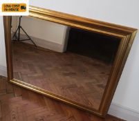 A contemporary gilt framed wall mirror with bevelled plate. 118x94cm.