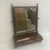 A 19th century mahogany toilet swing mirror with carved barleytwist supports over three frieze