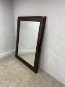 A very large and heavy contemporary faux rosewood wall or floor mirror. H.181 W.139 D.6cm