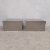 A pair of vintage stainless steel low plinths or bedside tables on castors. 34 x 62 x 62cm