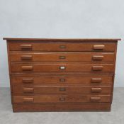 A C.1900 two section oak plan chest each section with three long drawers of panelled construction.