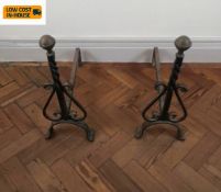 A pair of 19th century brass and iron fire dogs. H.53 L.52 cm.