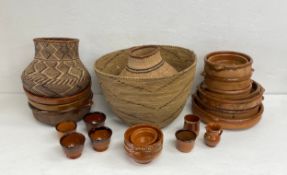 A mixed lot to include three vintage African wicker baskets together with a collection of terracotta
