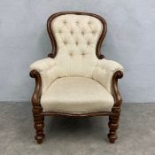 A 19th century carved mahogany armchair reupholstered in deep buttoned calico. H.105 Seat height