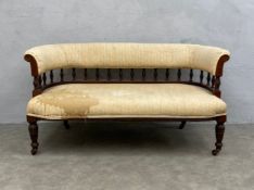 A small 19th century carved walnut sofa on turned tapering supports. H.70 W.135 D.71cm