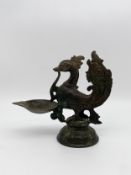 A 17th or 18th century Indian bronze figural Hamsa bird oil burner lamp. H.19 W.21 D.9cm